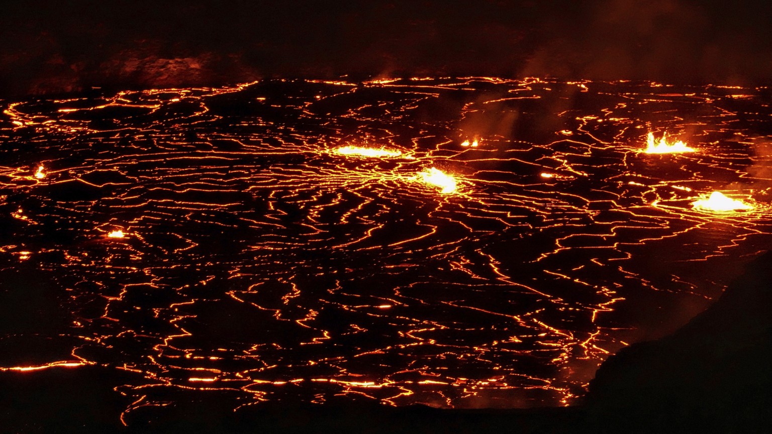 This photo provided by Volcano Hideaways shows lava erupting at Kilauea volcano&#039;s summit crater in Hawaii National Park, Hawaii on Friday, Jan. 6, 2023. Hawaii&#039;s Kilauea, one of the world&#0 ...