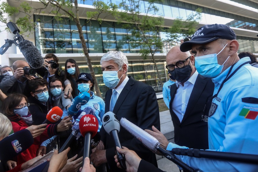 epa09125084 The defendant and former Prime Minister Jose Socrates (C), flanked by his lawyer Pedro Delille (2R), talks to the press after the reading of the instructional decision of the high-profile  ...