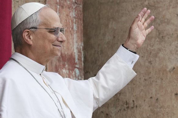Pope Leo XIV appears at the central balcony of St. Peter&#039;s Basilica for his first Sunday blessing after his election, in St. Peter&#039;s Square at the Vatican, Sunday May 11, 2025. (AP Photo/Dom ...