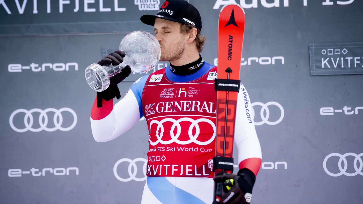 epa08277911 Mauro Caviezel from Switzerland, the winner of the Super-G Overall World Cup, kisses his Crystal Ball at an award ceremony after the World Cup in Super-G was canceled in Kvitfjell, Norway, ...