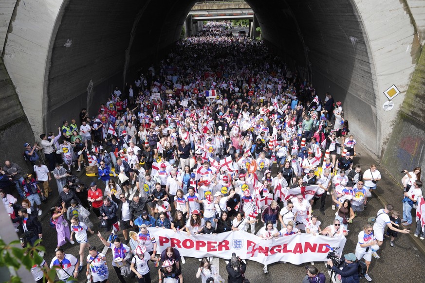 Fans of England march to the Women&#039;s Euro 2025 final soccer match between England and Spain at St. Jakob-Park in Basel, Switzerland, Sunday, July 27, 2025. (AP Photo/Martin Meissner)
Euro 2025 Fi ...
