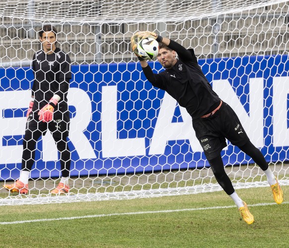 epa11403515 Switzerland goalkeepers Gregor Kobel, front, and Yann Sommer participate during a training session of the national team in Stuttgart, Germany, 11 June 2024. The Swiss national soccer team  ...