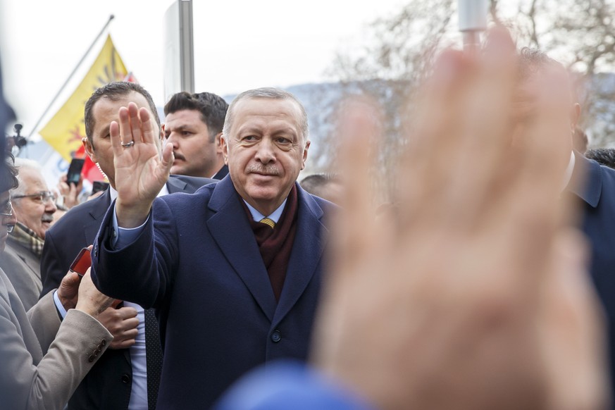 Turkey's President Recep Tayyip Erdogan greats people when arriving at his hotel one day before the opening UNHCR - Global Refugee Forum in Geneva, Switzerland, Monday, Dec. 16, 2019. (Salvatore ...