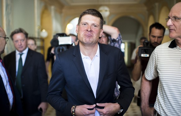 Former German road bicycle racer Jan Ullrich, center, during his trial at the Rathaus in Weinfelden, Switzerland, 21 July 2015. Jan Ullrich was involved in an accident with three cars near Mattwil, Sw ...