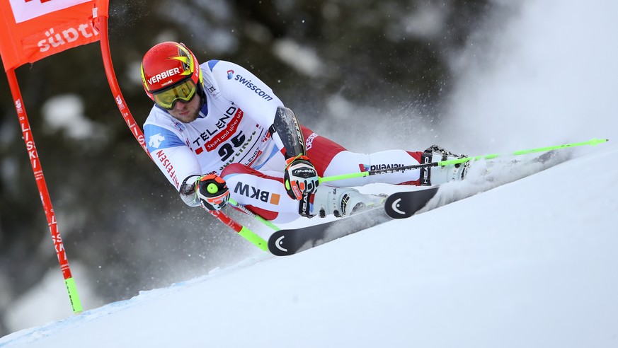 Switzerland&#039;s Justin Murisier speeds down the course during an alpine ski, men&#039;s World Cup giant slalom in Alta Badia, Italy, Sunday, Dec.20, 2020. (AP Photo/Marco Trovati)