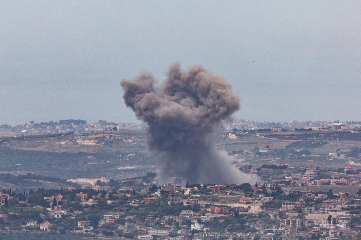 epa12950477 Smoke rises as a result of an Israeli strike on a south Lebanon village, as seen from the upper Galilee on the Israel-Lebanon border, 12 May 2026. EPA/ATEF SAFADI