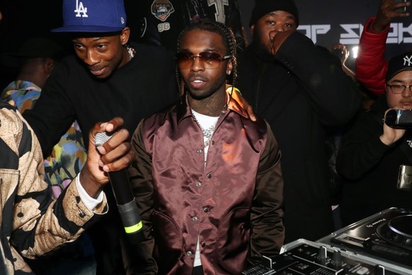 NEW YORK, NEW YORK - FEBRUARY 06: Recording artist Pop Smoke (c) attends the Pop Smoke Listening Party at Villain on February 06, 2020 in New York City. (Photo by Johnny Nunez/WireImage)