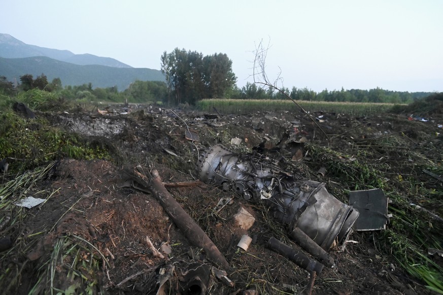 Debris of an Antonov cargo plane is seen in Palaiochori village in northern Greece, Sunday, July 17, 2022, after it reportedly crashed Saturday near the city of Kavala. The An-12, a Soviet-built turbo ...