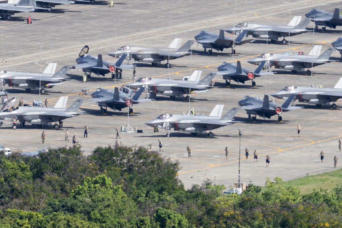 U.S. F-35 fighter jets are parked on the tarmac as military personnel walk among the aircraft at José Aponte de la Torre Airport in Ceiba, Puerto Rico, Saturday, Jan. 3, 2026. (AP Photo/Alejandro Gran ...