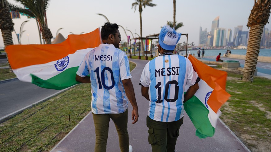 Fans wearing jerseys of Argentina arrive to a fan zone prior to the World Cup group A soccer match between Qatar and Ecuador at the Al Bayt Stadium in Al Khor, Qatar, Sunday, Nov. 20, 2022. (AP Photo/ ...