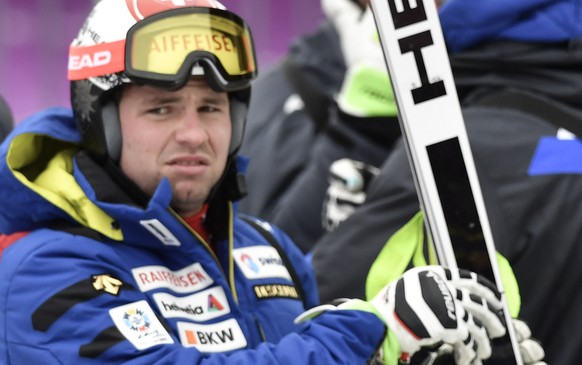 Switzerland&#039;s Beat Feuz, left, and Carlo Janka, right, look on in the finish area during a training session of the men&#039;s downhill race of the FIS Alpine Ski World Cup at the Lauberhorn, in W ...