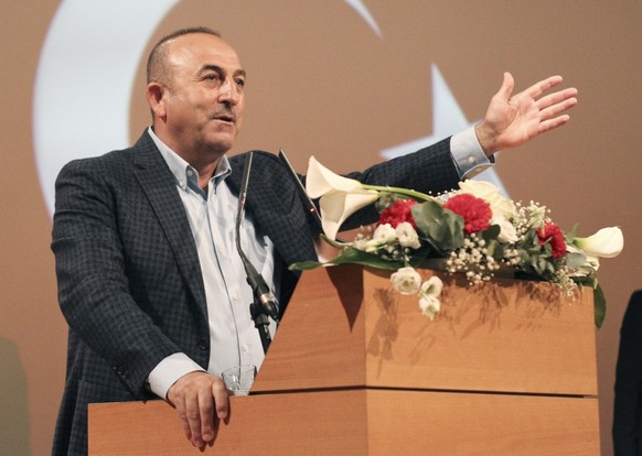 Turkish Foreign Minister Mevlut Cavusoglu, gestures as he speaks during a campaign gathering in Metz, eastern France, Sunday, March 12, 2017. Foreign Minister Mevlut Cavusoglu was in France Sunday to  ...