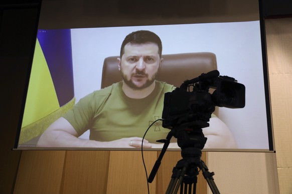 Ukrainian President Volodymyr Zelenskyy addresses members of the South Korea Parliament via video link at the National assembly on Monday, April 11, 2022 in Seoul, South Korea. Zelenskyy called for So ...