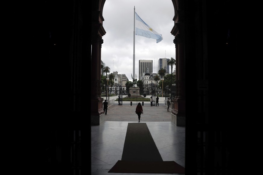 An Argentine flag waves over Plaza de Mayo square, seen through a door at the presidential palace in Buenos Aires, Argentina, Thursday, Nov. 29, 2018. Leaders from the Group of 20 industrialized natio ...