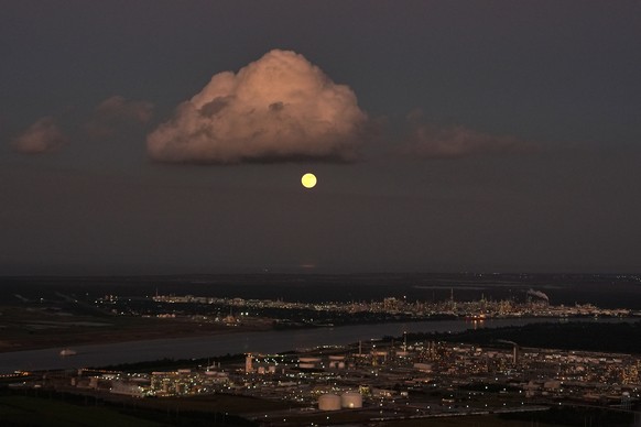 In this aerial photo, a supermoon rises above the Dow Chemical Plant and the Shell Norco Oil Refinery along the Mississippi River in St. John the Baptist Parish, La., Wednesday, Nov. 5, 2025. (AP Phot ...