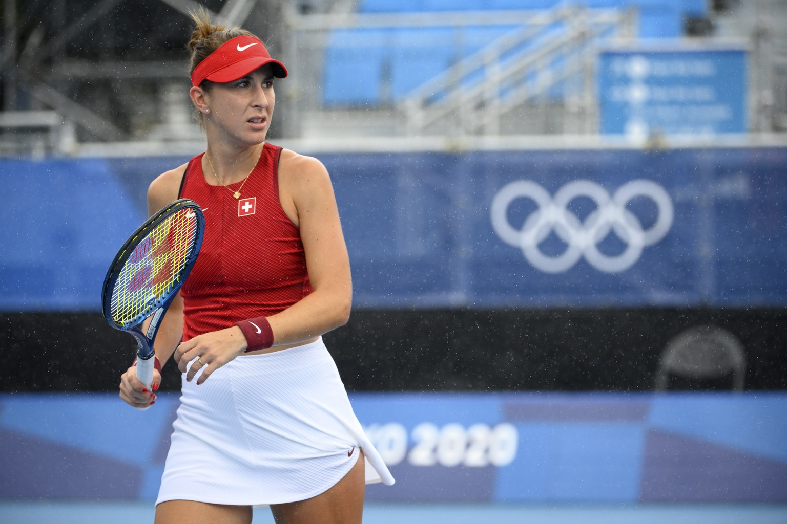 Belinda Bencic of Switzerland reacts after missing a ball against Barbora Krejcikova of Czech Republic during the women&#039;s singles tennis third round match at the 2020 Tokyo Summer Olympics at the ...