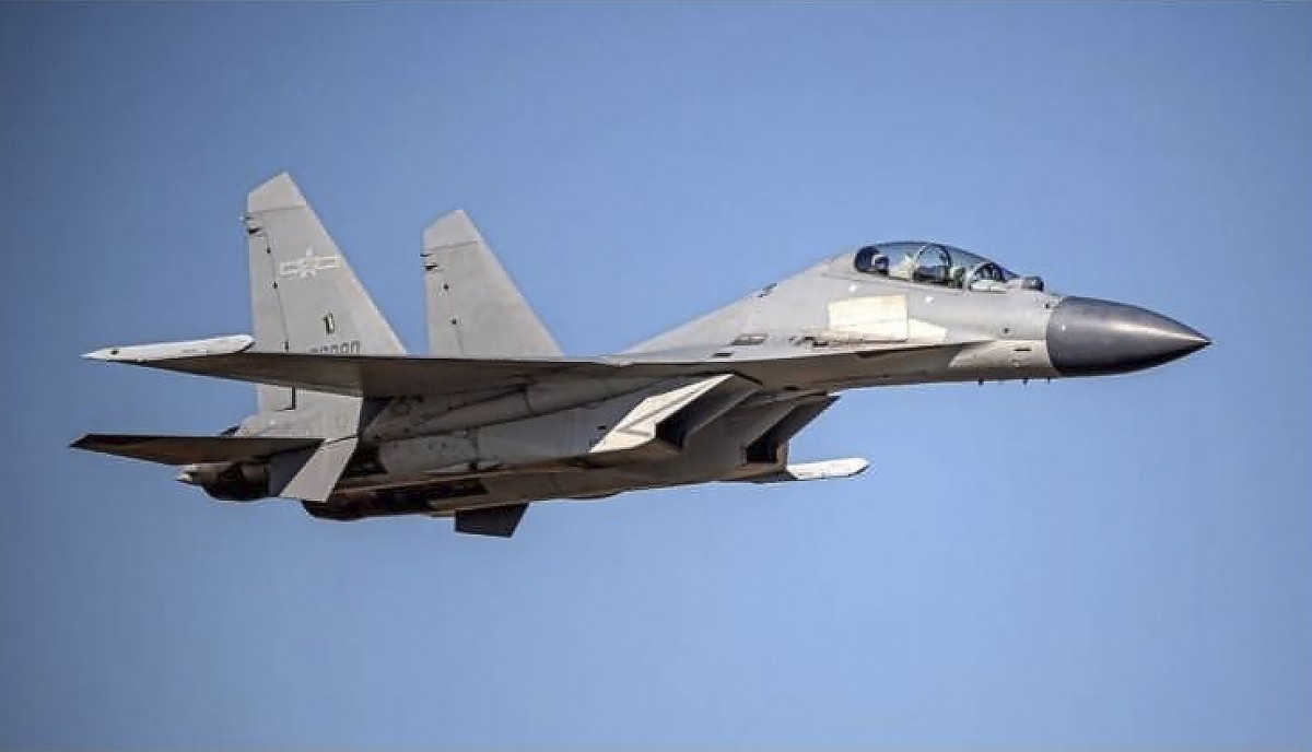 FILE -In this undated file photo released by the Taiwan Ministry of Defense, a Chinese PLA J-16 fighter jet flies in an undisclosed location. China flew more than 30 military planes toward Taiwan on S ...