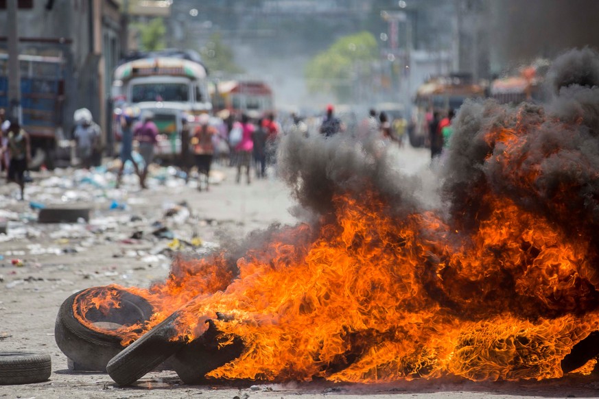 epa07813671 View of a barricade burning in a street of Port-au-Prince, Haiti, 02 September 2019. The Haitian capital city was paralyzed by the numerous riots against the lack of fuel that forced the c ...