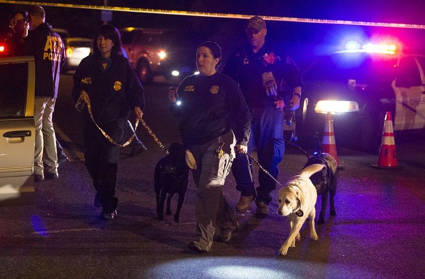 Police dogs and their handlers deploy at the scene of an explosion in southwest Austin, Texas, Sunday, March 18, 2018. Injuries were reported in the explosion, this one coming after three package bomb ...