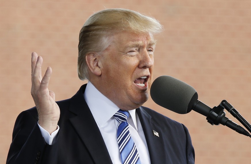 President Donald Trump gestures as he delivers the commencement address at Liberty University in Lynchburg, Va., Saturday, May 13, 2017. (AP Photo/Steve Helber)