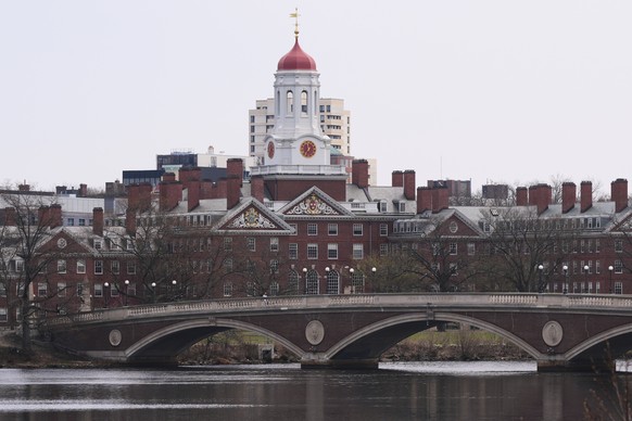 Water flows down the Charles River near Harvard University, in background. Tuesday, April 15, 2025, in Cambridge, Mass. (AP Photo/Charles Krupa)
Harvard-Subway-Shooting