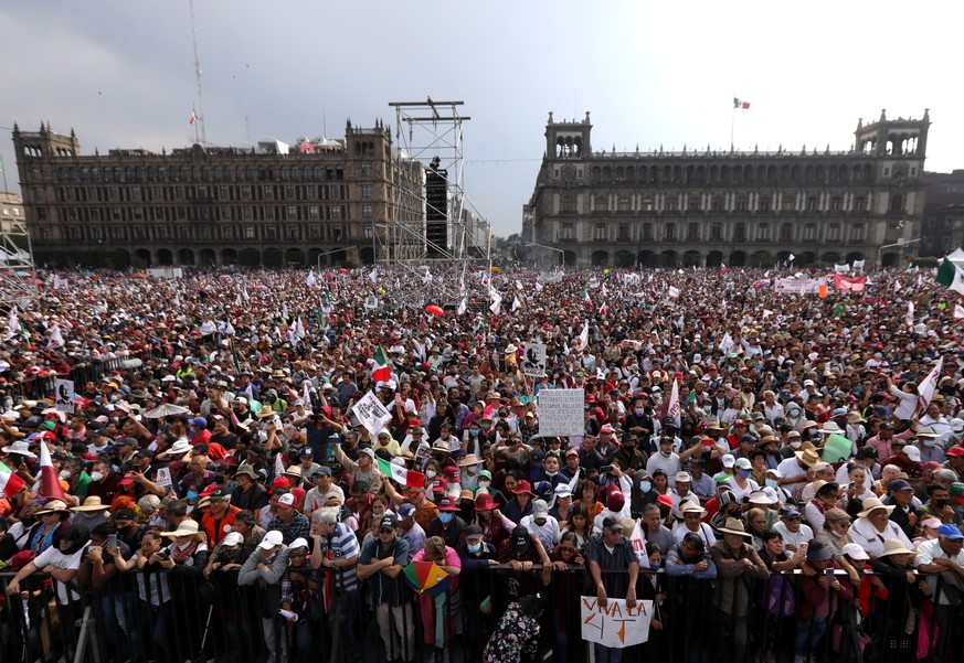 epa10333511 Supporters attend the fourth government report of President Andres Manuel Lopez Obrador, in the Zocalo city square in Mexico City, Mexico, 27 November 2022. Lopez Obrador marched with supp ...