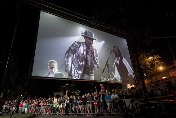 The Tragically Hip&#039;s frontman Gord Downie is displayed on a screen during a public viewing of the band&#039;s final concert in Halifax, Nova Scotia, Saturday, Aug. 20, 2016. (Darren Calabrese/The ...