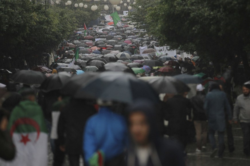 Algerian demonstrators take to the streets in the capital Algiers to protest against the government and reject the upcoming presidential elections, in Algeria, Friday, Nov. 15, 2019. (AP Photo/Fateh G ...