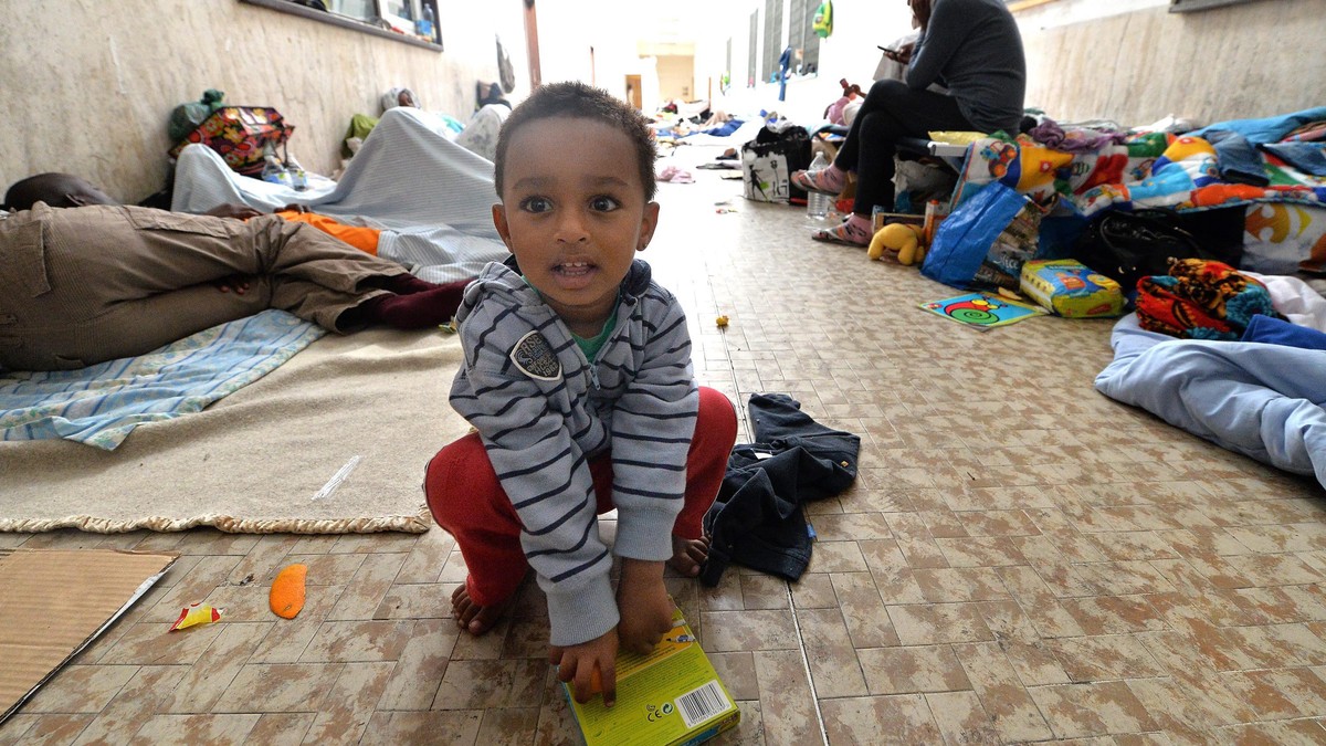 epa04806144 Stranded migrants take shelter in a hall of the train station of Ventimiglia, on the Italian border with France, Ventimiglia, Italy, 18 June 2015. The migrants, who wished to cross the bor ...