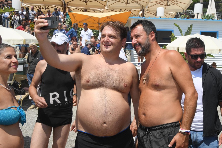 epaselect epa07767987 Italian Deputy Prime Minister and Interior Minister Matteo Salvini (R) takes a selfie with supporters during his 'Italian summer tour' in Taormina, Sicily Island, southern Italy, ...