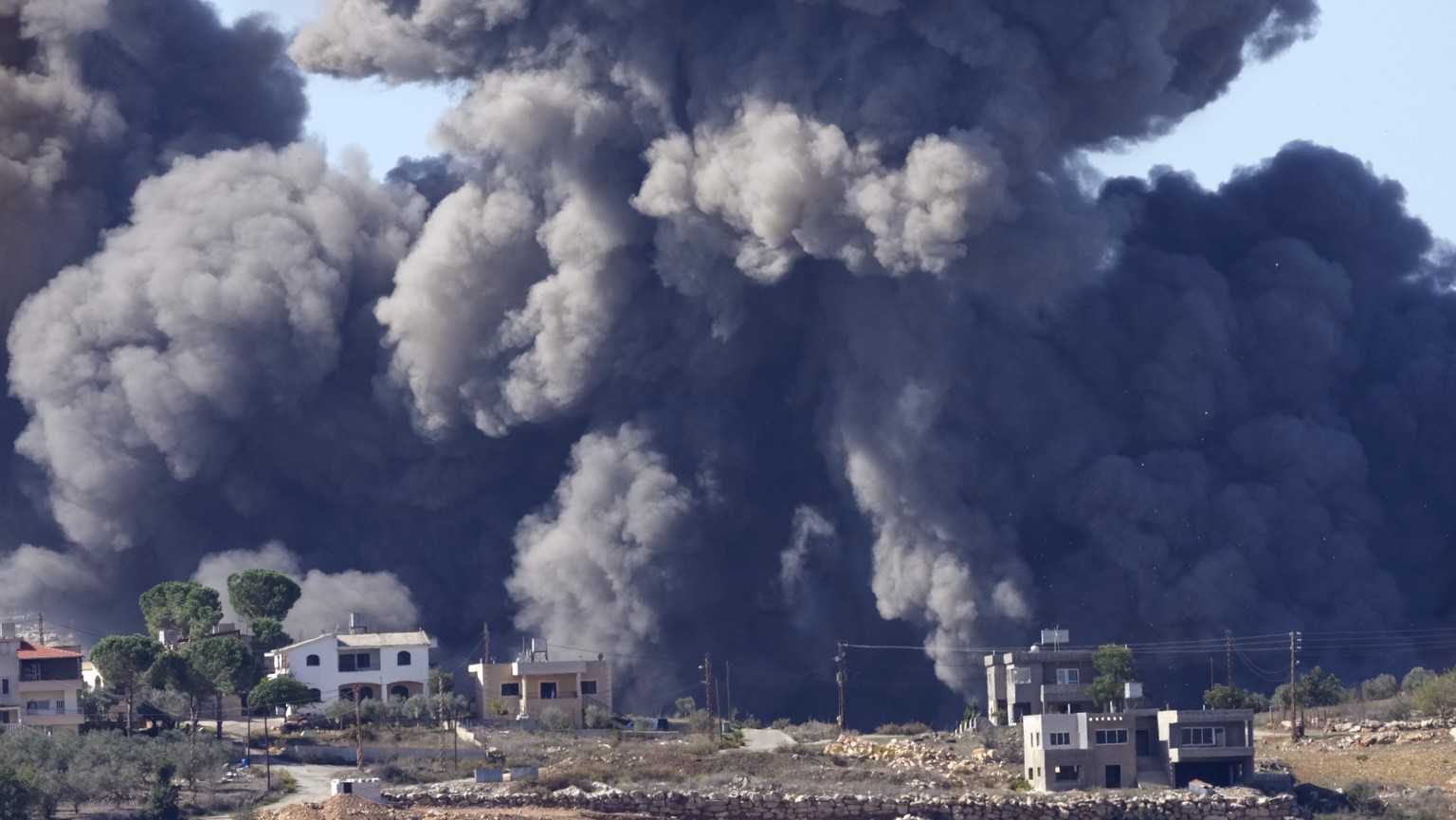 Black smoke rises from an Israeli airstrike on the outskirts of Aita al-Shaab, a Lebanese border village with Israel in south Lebanon, Saturday, Nov. 4, 2023. The Lebanon-Israel border has been the si ...