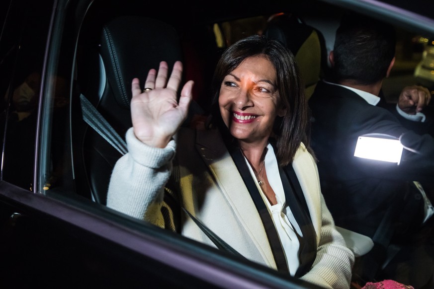 epa09524287 The winner of the left-wing primaries Paris Mayor Anne Hidalgo greets her supporters in her car after the announcement of the results of the left-wing party primaries ahead of the 2022 pre ...
