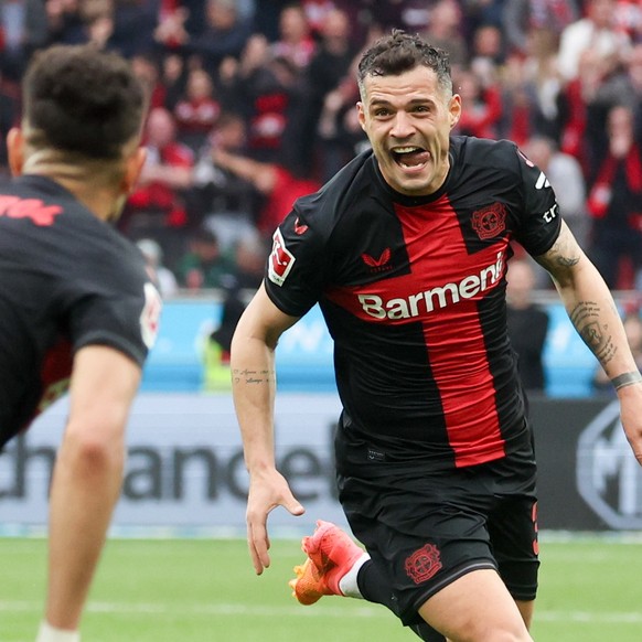 epa11278631 Leverkusen&#039;s Granit Xhaka (C) celebrates scoring the 2-0 lead during the German Bundesliga soccer match between Bayer 04 Leverkusen and SV Werder Bremen in Leverkusen, Germany, 14 Apr ...
