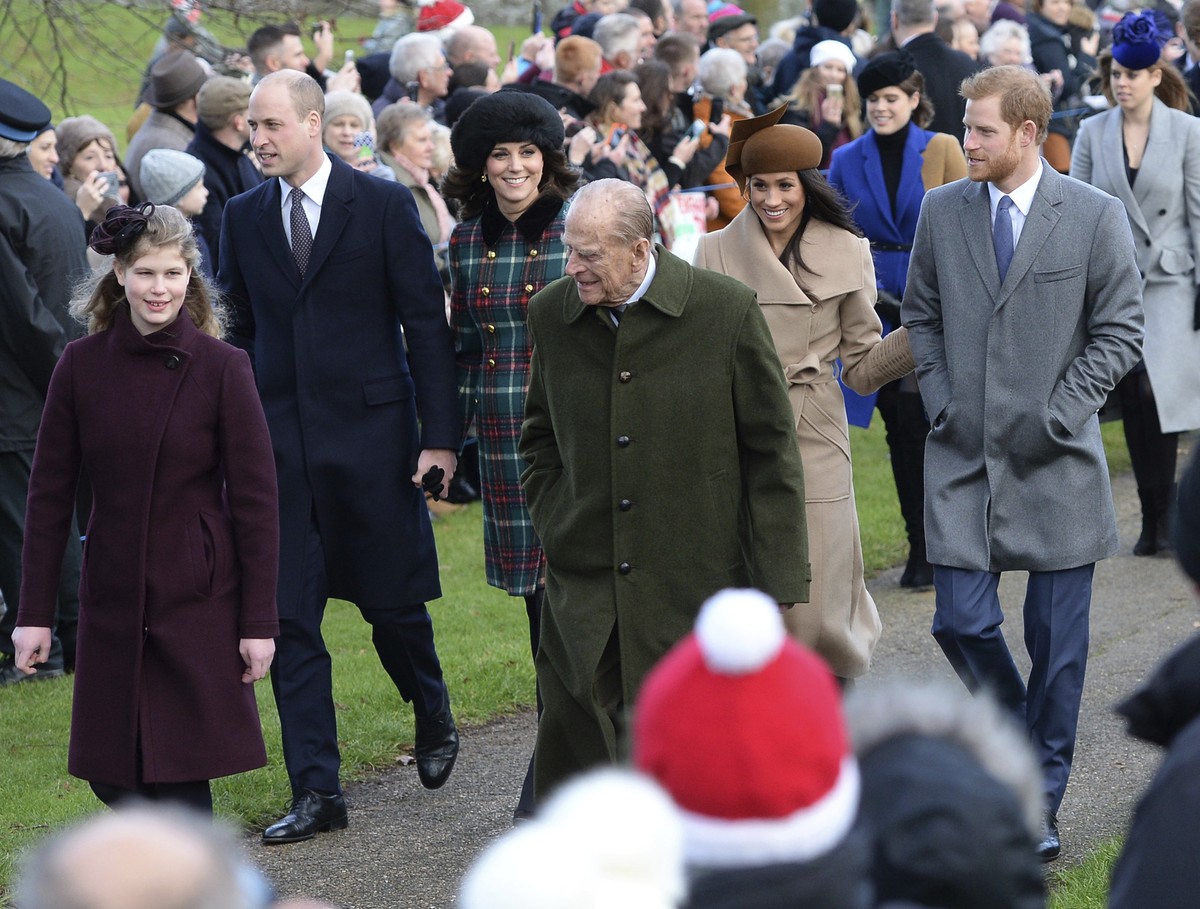 FILE - In this Dec. 25, 2017 file photo, Britain's Prince Philip, center, walks with Lady Louise Windsor, left, Prince William, second left, and Kate, Duchess of Cambridge, center left, Prince Ha ...