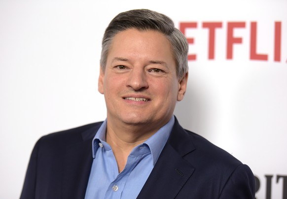 FILE - In this Feb. 1, 2017 file photo, Netflix CCO Ted Sarandos arrives at the season one premiere of &quot;Santa Clarita Diet&quot; in Los Angeles. Sarandos says the streaming service is pulling its ...