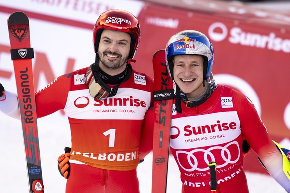 Second placed Loic Meillard of Switzerland, and winner Marco Odermatt of Switzerland pose after the second run of the men&#039;s Giant Slalom race at the Alpine Skiing FIS Ski World Cup, in Adelboden, ...