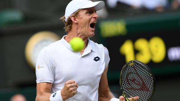 Kevin Anderson of South Africa celebrates winning a point from John Isner of the US during their men&#039;s singles semifinal match at the Wimbledon Tennis Championships, in London, Friday July 13, 20 ...