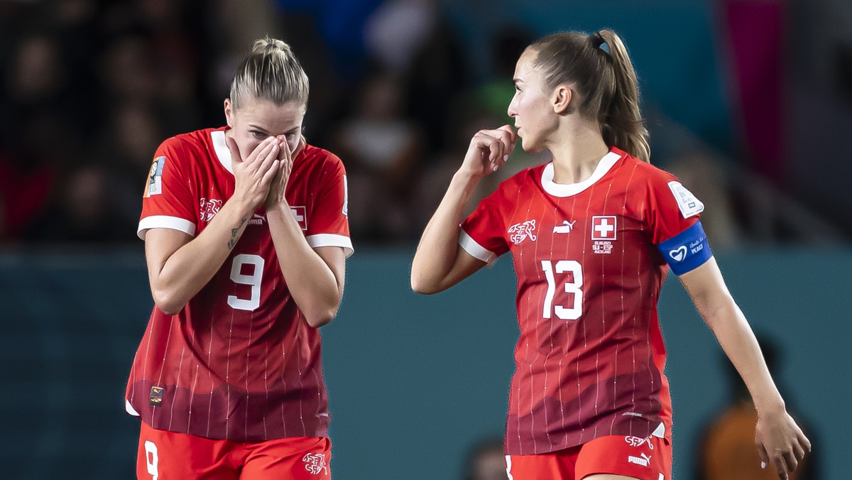 Switzerland's captain midfielder Lia Waelti, right, forward Ana Maria Crnogorcevic, center, and Julia Stierli, left, show dejection after the team's 1-5 defeat and elimination from the tourn ...