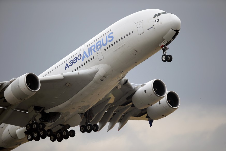FILE - In this June 18, 2015, file photo, an Airbus A380 takes off for its demonstration flight at the Paris Air Show in Le Bourget airport, north of Paris. Airbus says its first-quarter profit is up  ...