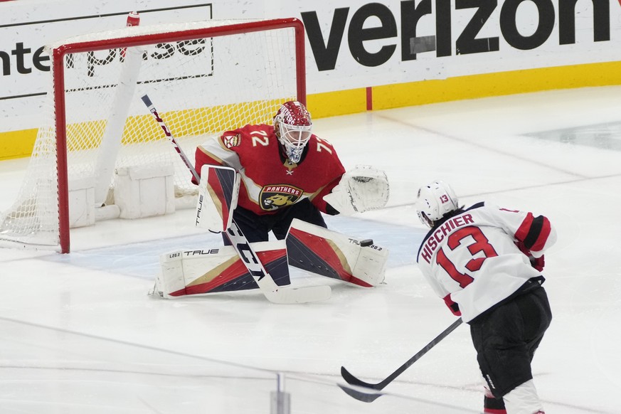 New Jersey Devils center Nico Hischier (13) scores on Florida Panthers goaltender Sergei Bobrovsky (72) during the second period of an NHL hockey game Saturday, March 18, 2023, in Sunrise, Fla. (AP Ph ...