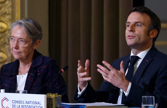 epa10361654 French President Emmanuel Macron (R) delivers a speech next to French Prime Minister Elisabeth Borne (L), during the second plenary session of the Conseil National de la Refondation (CNR - ...