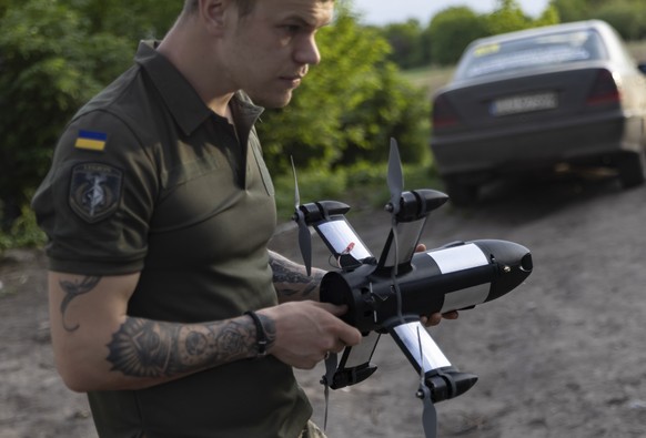 epaselect epa12981174 A serviceman of the 116th Mechanized Brigade operates a Ukraine-made P1-Sun drone to intercept Russian 'Shahed' type, and other strike or reconnaissance drones in the n ...