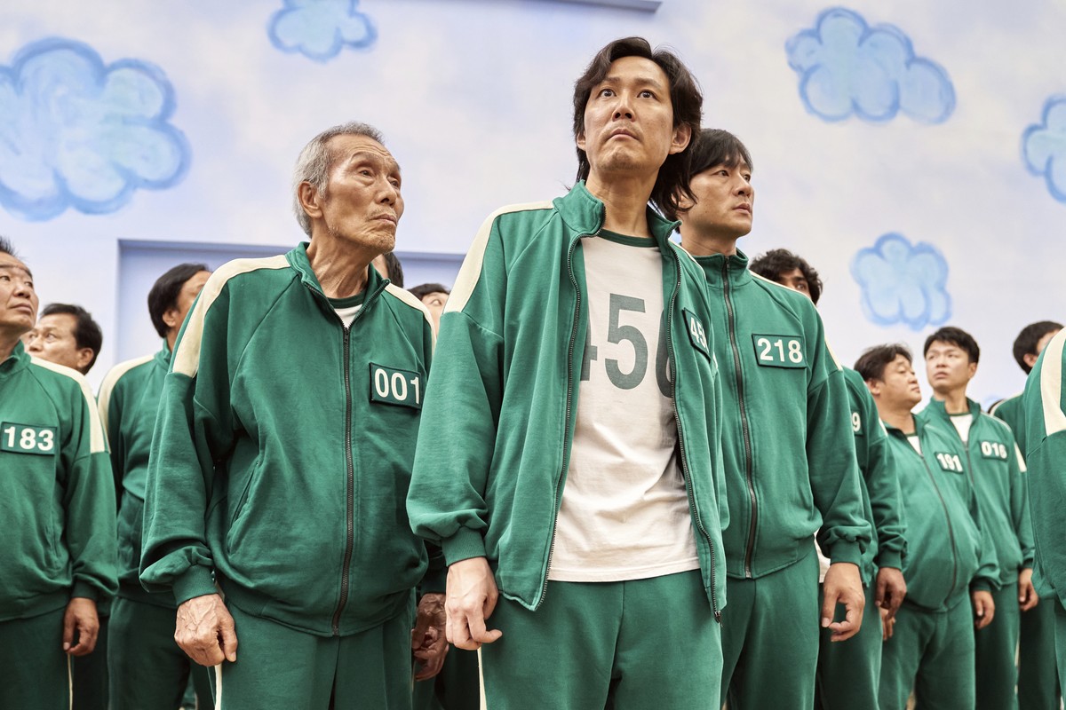 This image released by Netflix shows Lee Jung-jae, center, Park Hae-soo, right, and Oh Yeong-soo in a scene from the Korean series "Squid Game." Both Park Hae-Soo and Oh Yeong-Su were nomina ...