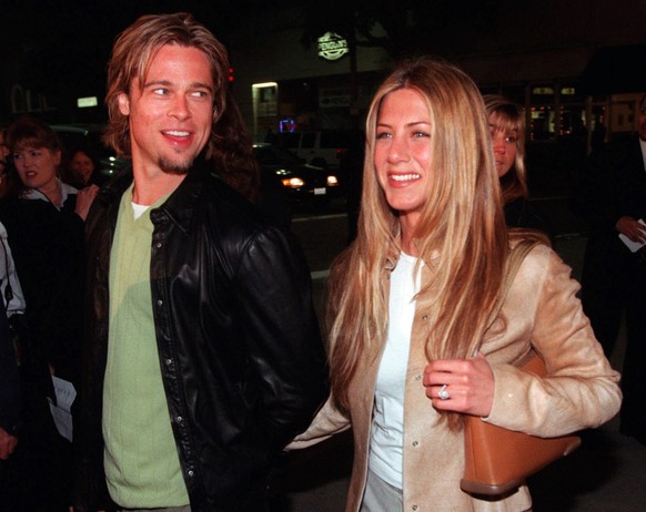 FILE - In this March 14, 2000 file photo, actor Brad Pitt, left, and actress Jennifer Aniston, arrive at the premiere of the new film &quot;Erin Brockovich,&quot; in the Westwood section of Los Angele ...