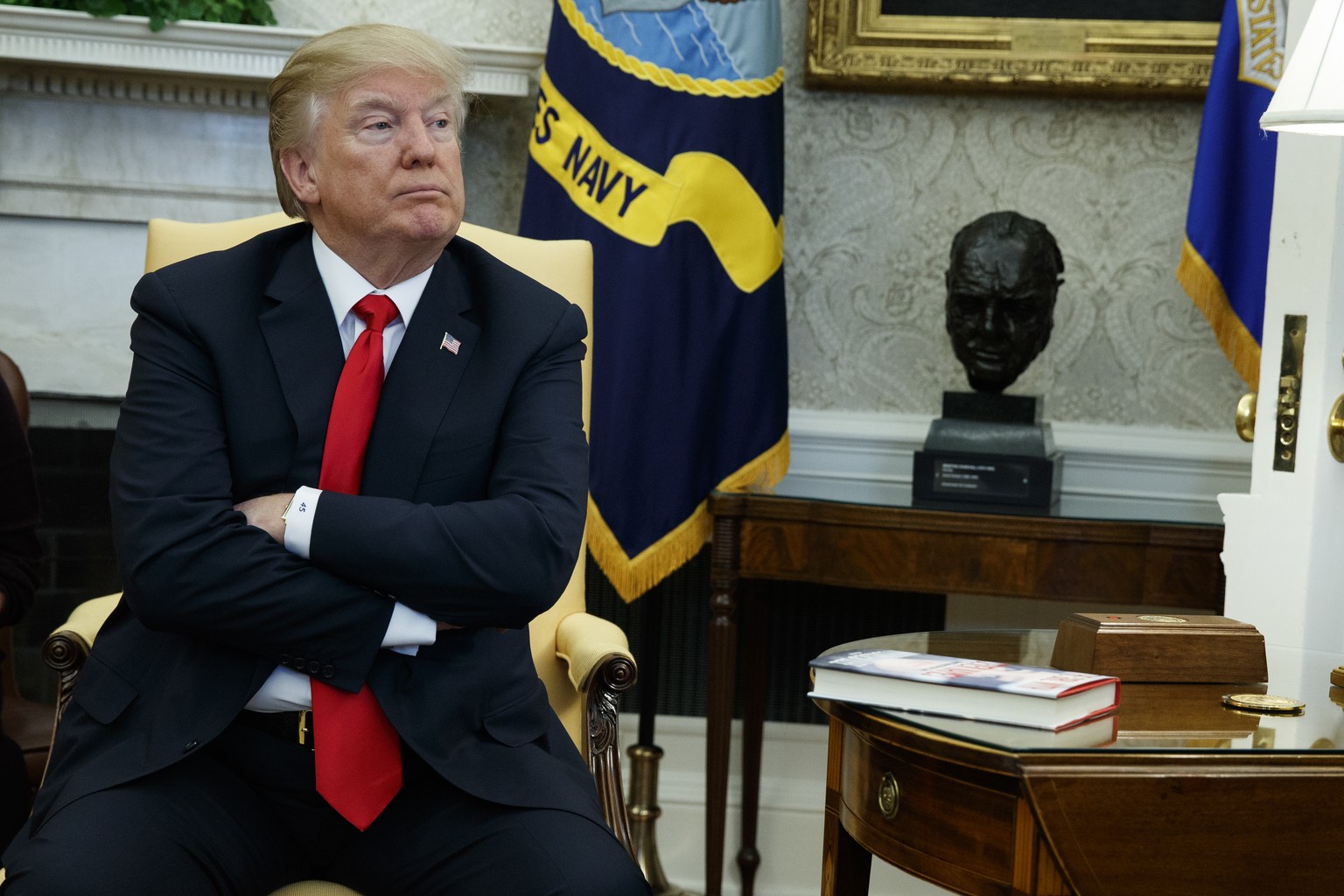 FILE - In this Friday, Feb. 2, 2018 file photo, President Donald Trump listens during a meeting with North Korean defectors where he talked with reporters about allowing the release of a secret memo o ...