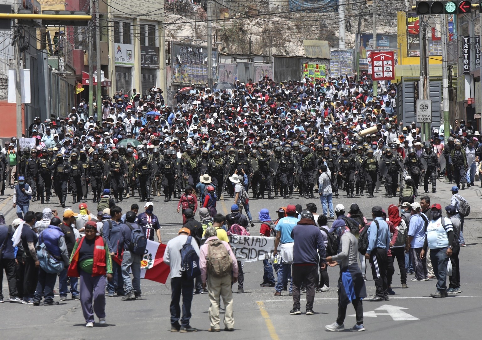 Police arrive where supporters of ousted Peruvian President Pedro Castillo protest his detention in Arequipa, Peru, Wednesday, Dec. 14, 2022. Castillo was detained on Dec. 7 after he was ousted by law ...