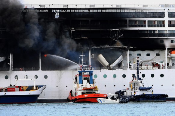 epa09069962 A fire broke out on the 'MSC Lirica' cruiseship on 12 March 2021, while it was tied at the Corfu port, Ionian Sea, Greece, since January 30 for the winter season. Onboard were cr ...