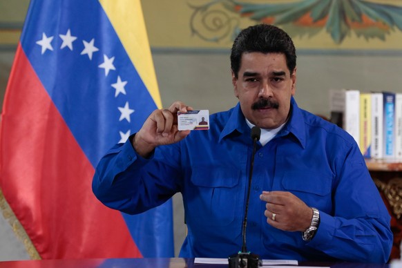 epa06235277 A handout photo made available by Miraflores Press shows Venezuelan President Nicolas Maduro speaking during a televised address, in Caracas, Venezuela, 29 September 2017. 
Venezuelan Pre ...