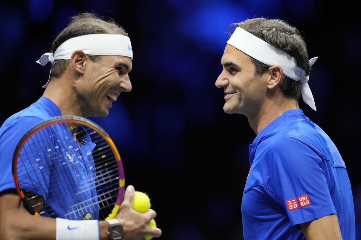 Team Europe's Roger Federer, right, and Rafael Nadal react during their Laver Cup doubles match against Team World's Jack Sock and Frances Tiafoe at the O2 arena in London, Friday, Sept. 23, ...