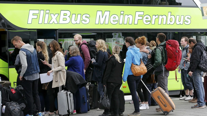 Passengers board a bus of &#039;FlixBus&#039; coach operator at the main bus station (ZOB) during a strike of train drivers&#039; union GDL in Berlin, Germany, May 20, 2015. Freight services in German ...